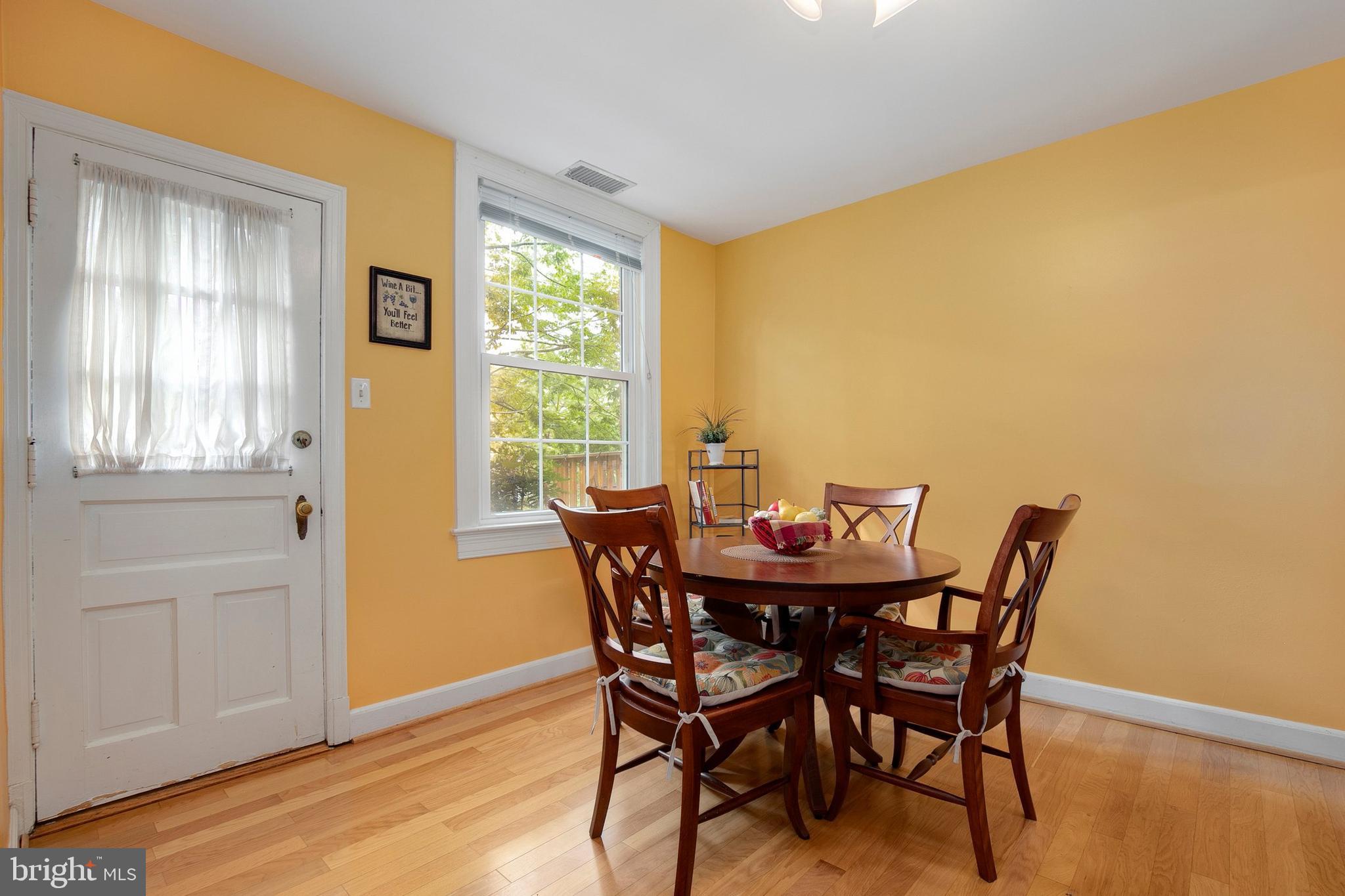 2700 13th Road South, Unit 379 Arlington, VA 22204 - Photo 13 of 26 a view of a dining room with furniture and wooden floor