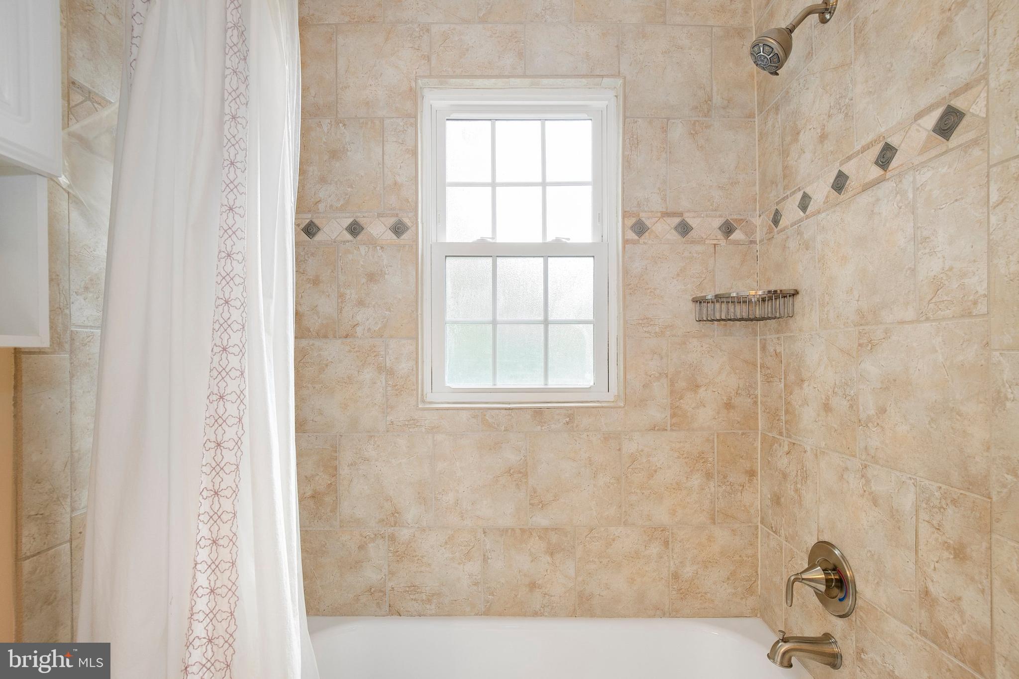 2700 13th Road South, Unit 379 Arlington, VA 22204 - Photo 16 of 26 a bathroom with a bathtub and shower