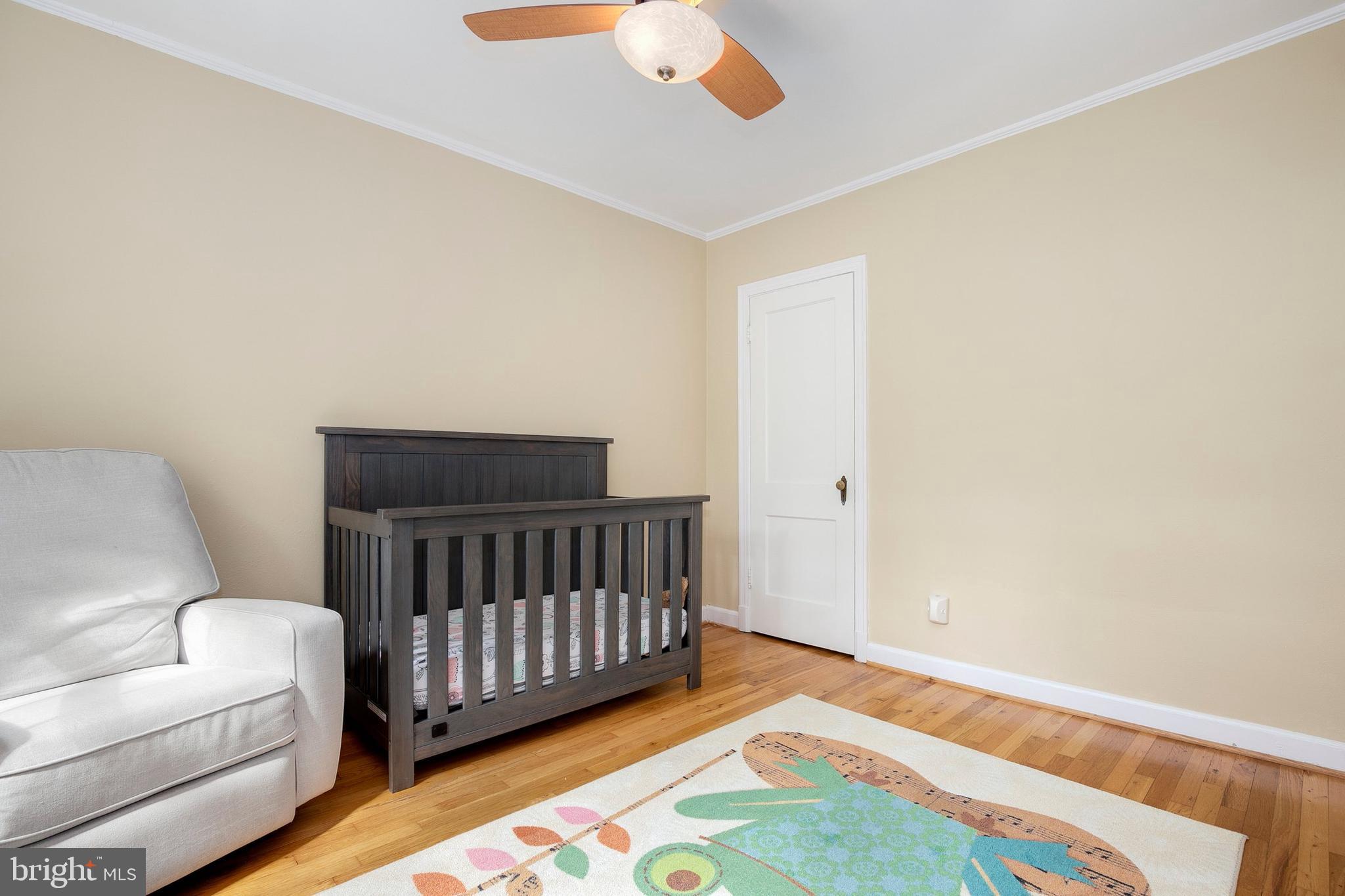 2700 13th Road South, Unit 379 Arlington, VA 22204 - Photo 18 of 26 a bedroom with a bed and wooden floor