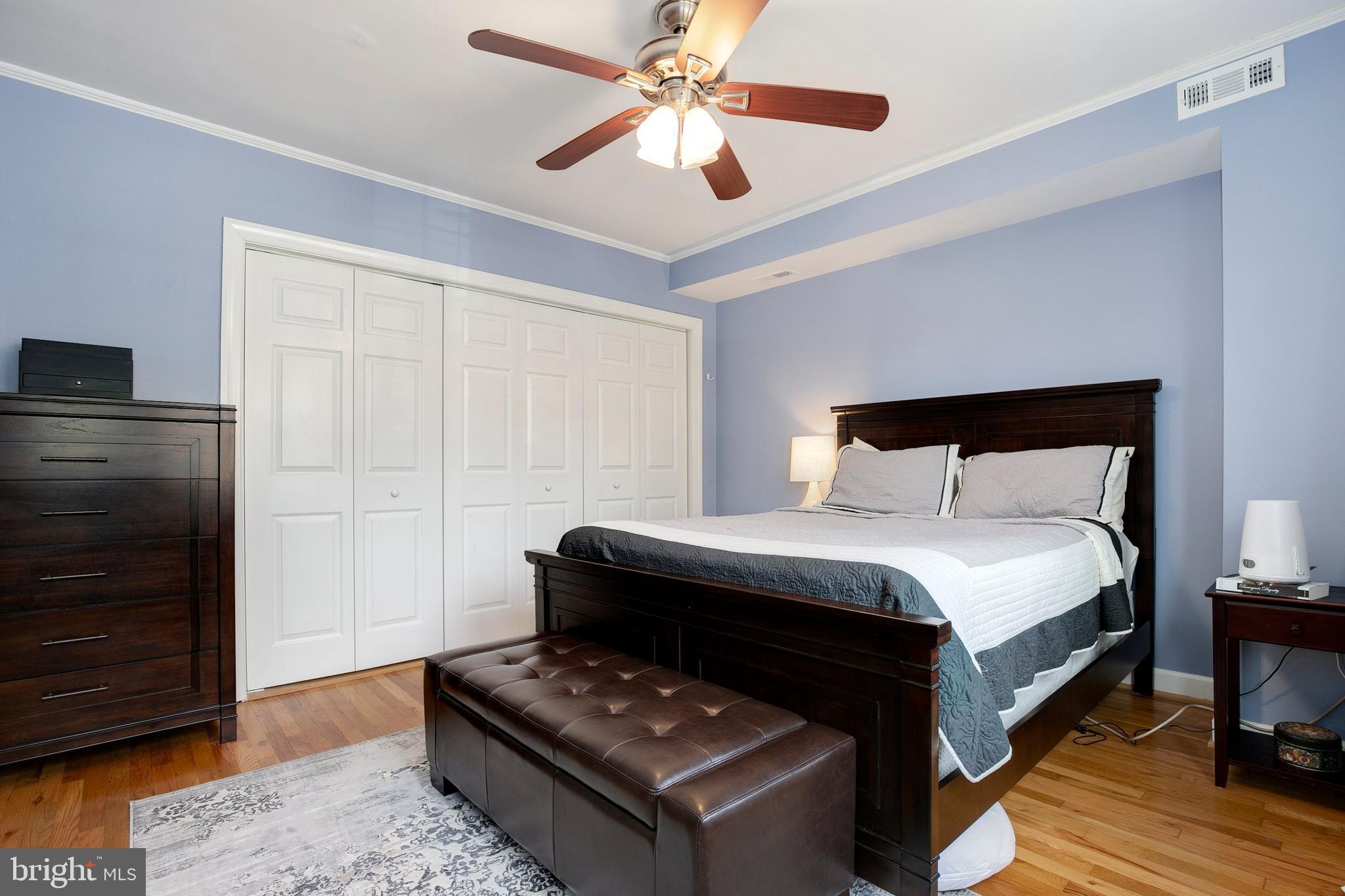 2700 13th Road South, Unit 379 Arlington, VA 22204 - Photo 21 of 26 a bedroom with a bed and a chandelier