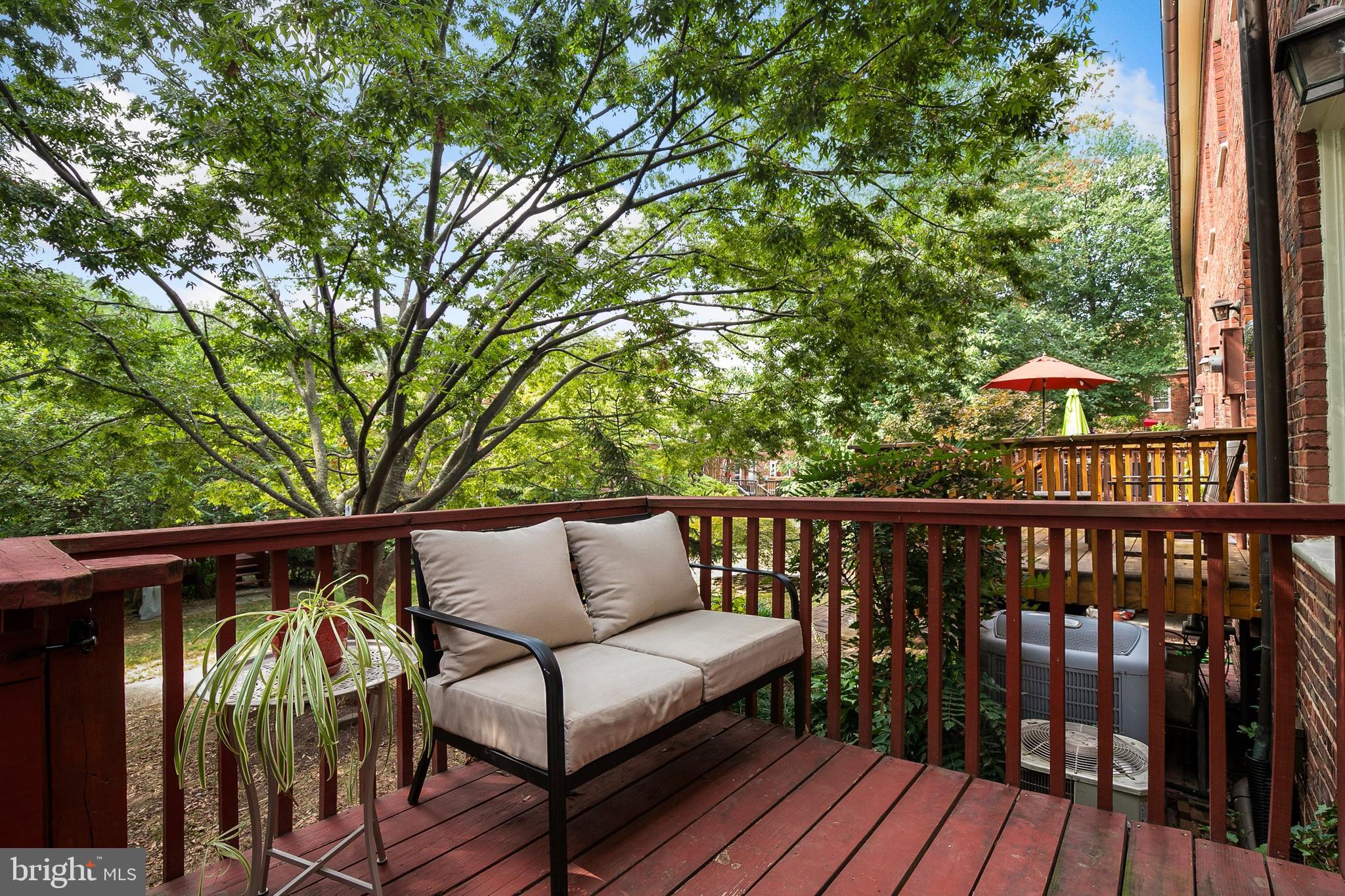 2700 13th Road South, Unit 379 Arlington, VA 22204 - Photo 25 of 26 a view of roof deck with wooden floor and outdoor seating