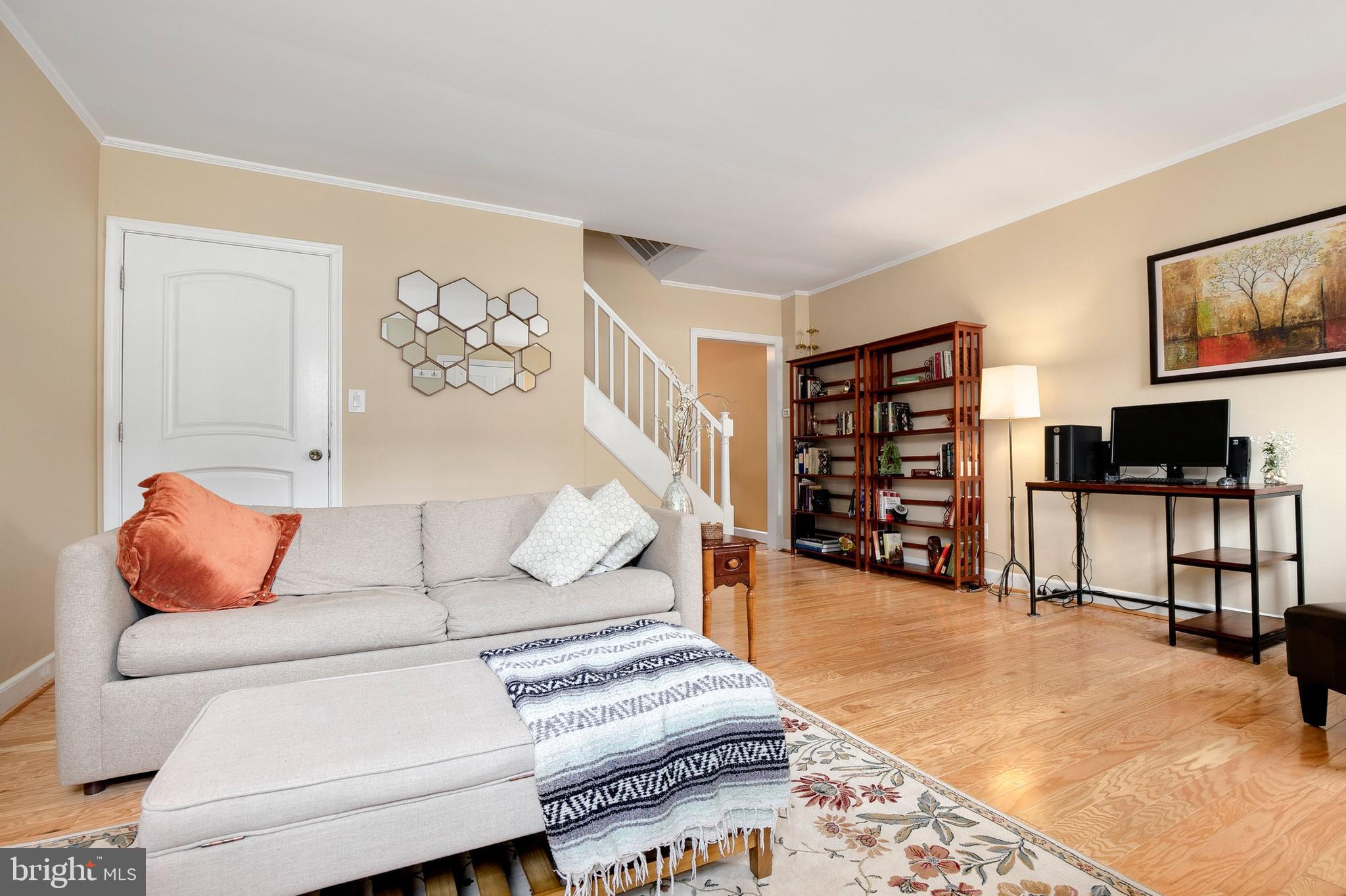 2700 13th Road South, Unit 379 Arlington, VA 22204 - Photo 6 of 26 a living room with furniture and a flat screen tv