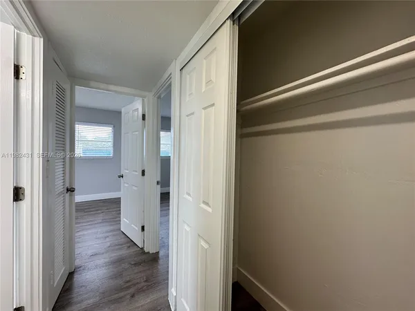 a view of a bathroom from the hallway