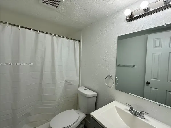 a bathroom with a sink and toilet
