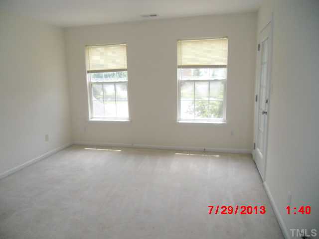 3205 Enchanting Way Raleigh, NC 27616 - Photo 9 of 13 an empty room with a window