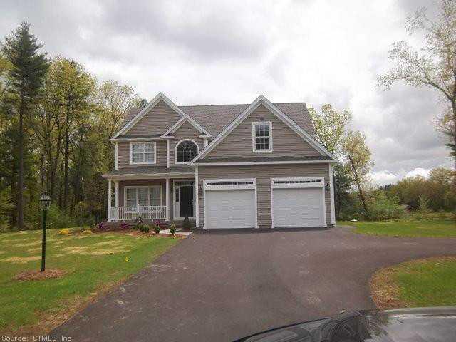 10 Aspen Ridge Somers, CT 06071 - Photo 1 of 1 a front view of a house with a yard and garage