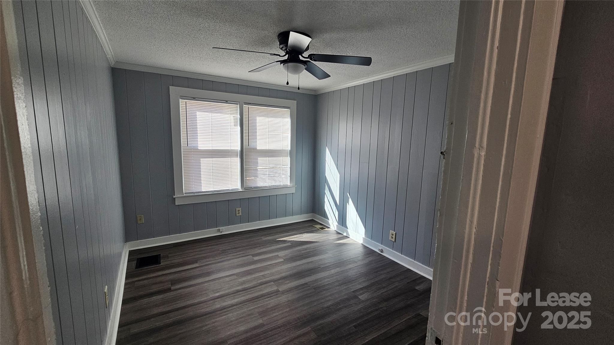 1132 Camden Avenue Rock Hill, SC 29732 - Photo 11 of 26 a view of wooden floor and a chandelier fan in a room