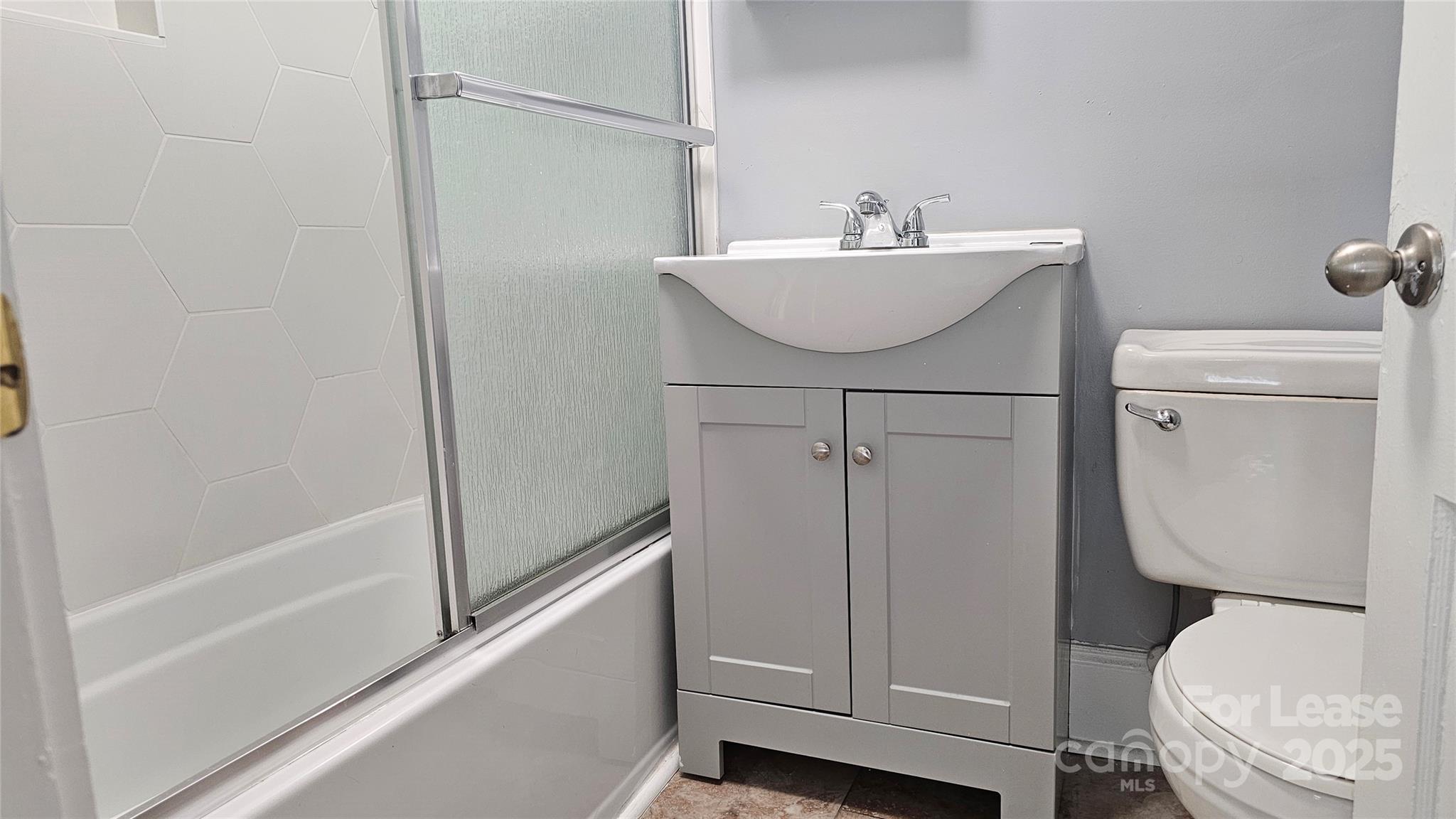 1132 Camden Avenue Rock Hill, SC 29732 - Photo 14 of 26 a bathroom with a sink a toilet and shower