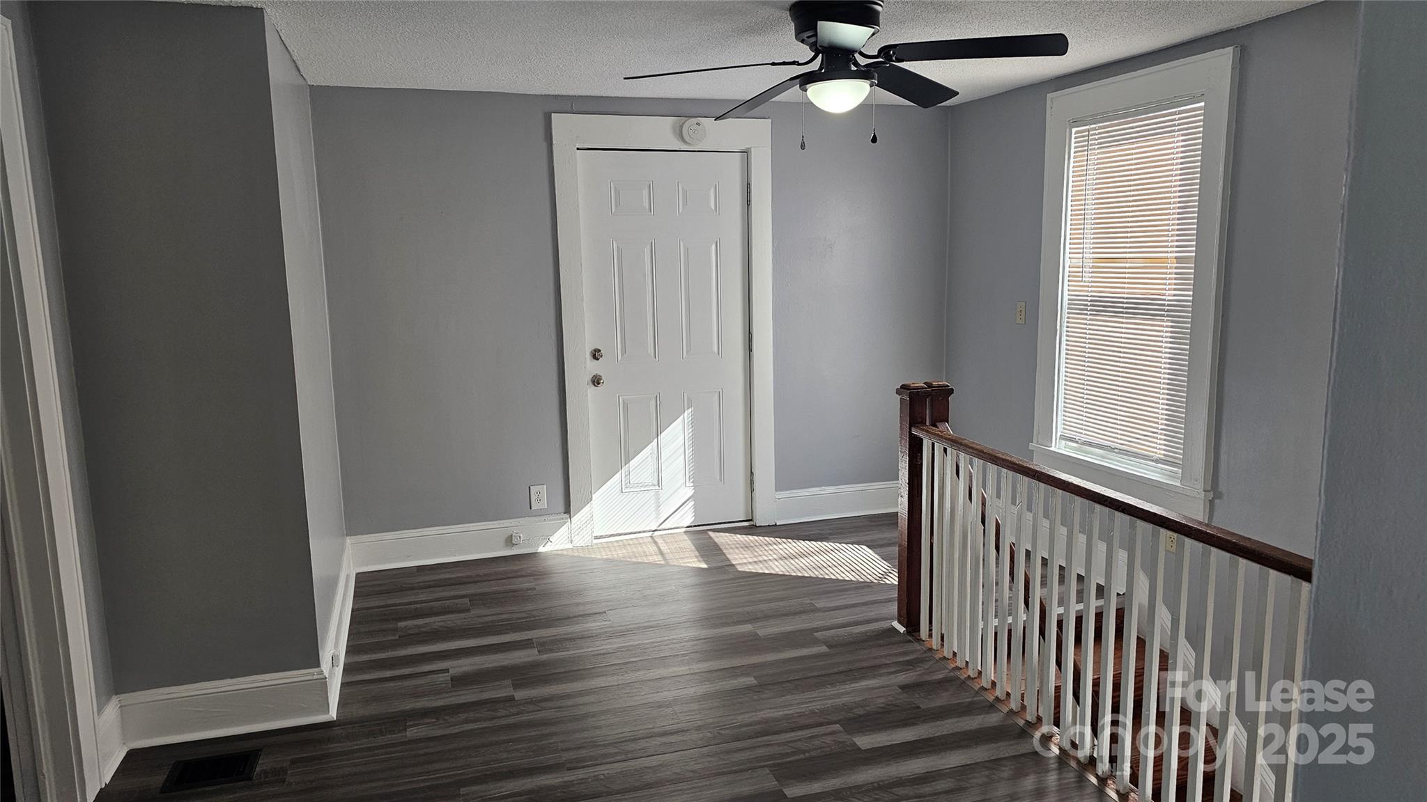 1132 Camden Avenue Rock Hill, SC 29732 - Photo 15 of 26 a view of a hallway with wooden floor and staircase