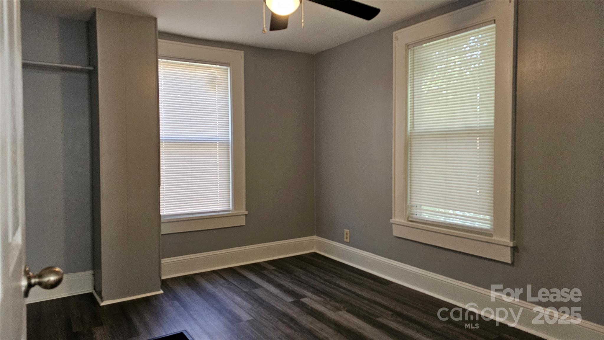 1132 Camden Avenue Rock Hill, SC 29732 - Photo 17 of 26 a view of an empty room with wooden floor and a window
