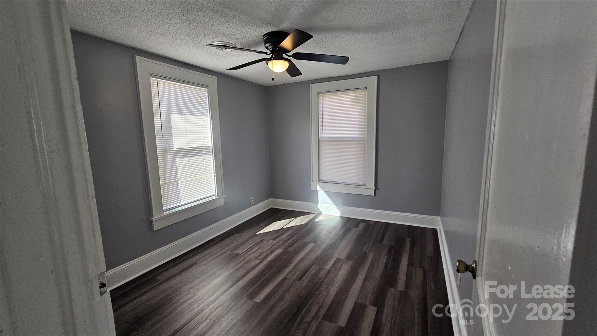 1132 Camden Avenue Rock Hill, SC 29732 - Photo 19 of 26 a view of empty room with wooden floor and fan