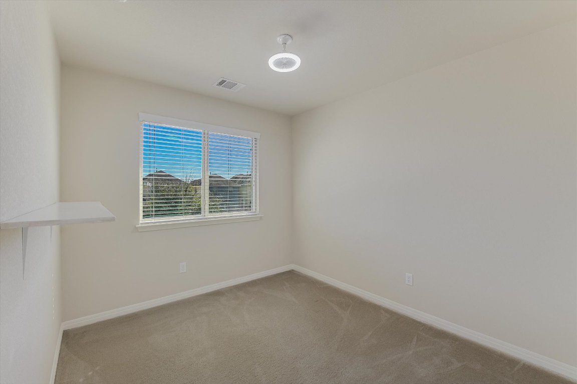 4609 Esper Lane, Unit 323 Austin, TX 78725 - Photo 14 of 20 an empty room with a window