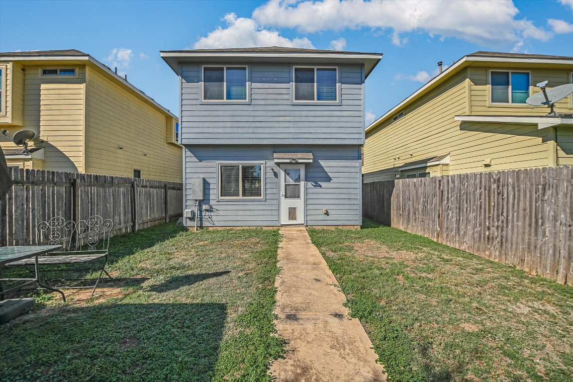 4609 Esper Lane, Unit 323 Austin, TX 78725 - Photo 19 of 20 a front view of a house with a yard