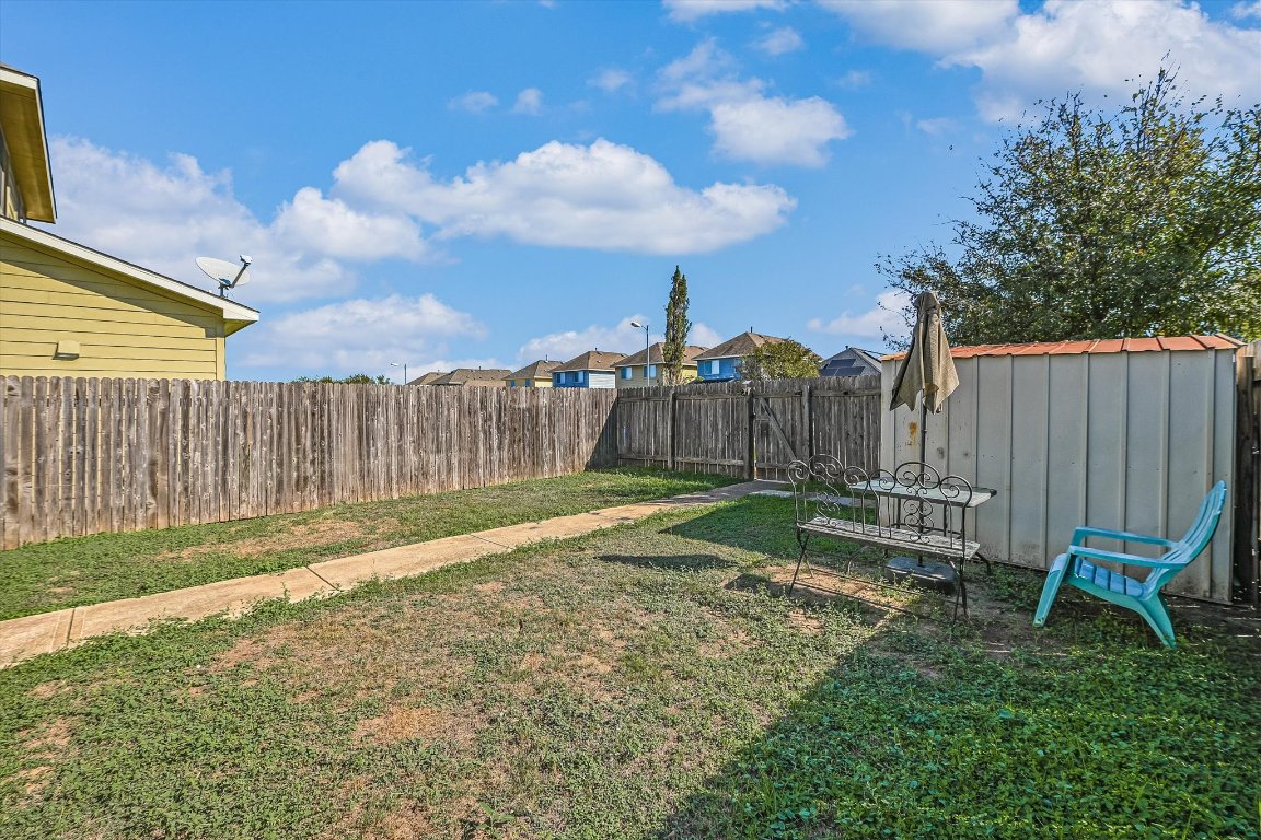 4609 Esper Lane, Unit 323 Austin, TX 78725 - Photo 20 of 20 a view of backyard with wooden fence