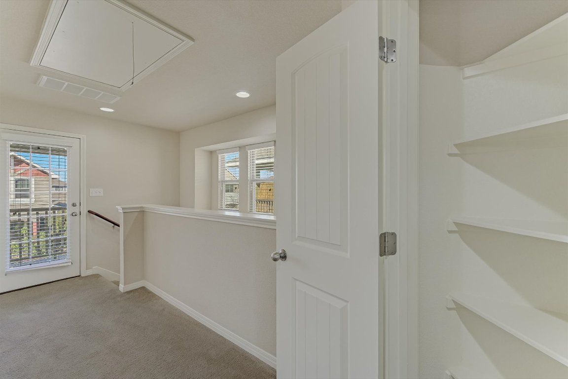 4609 Esper Lane, Unit 323 Austin, TX 78725 - Photo 10 of 20 a view of livingroom with hardwood floor and windows