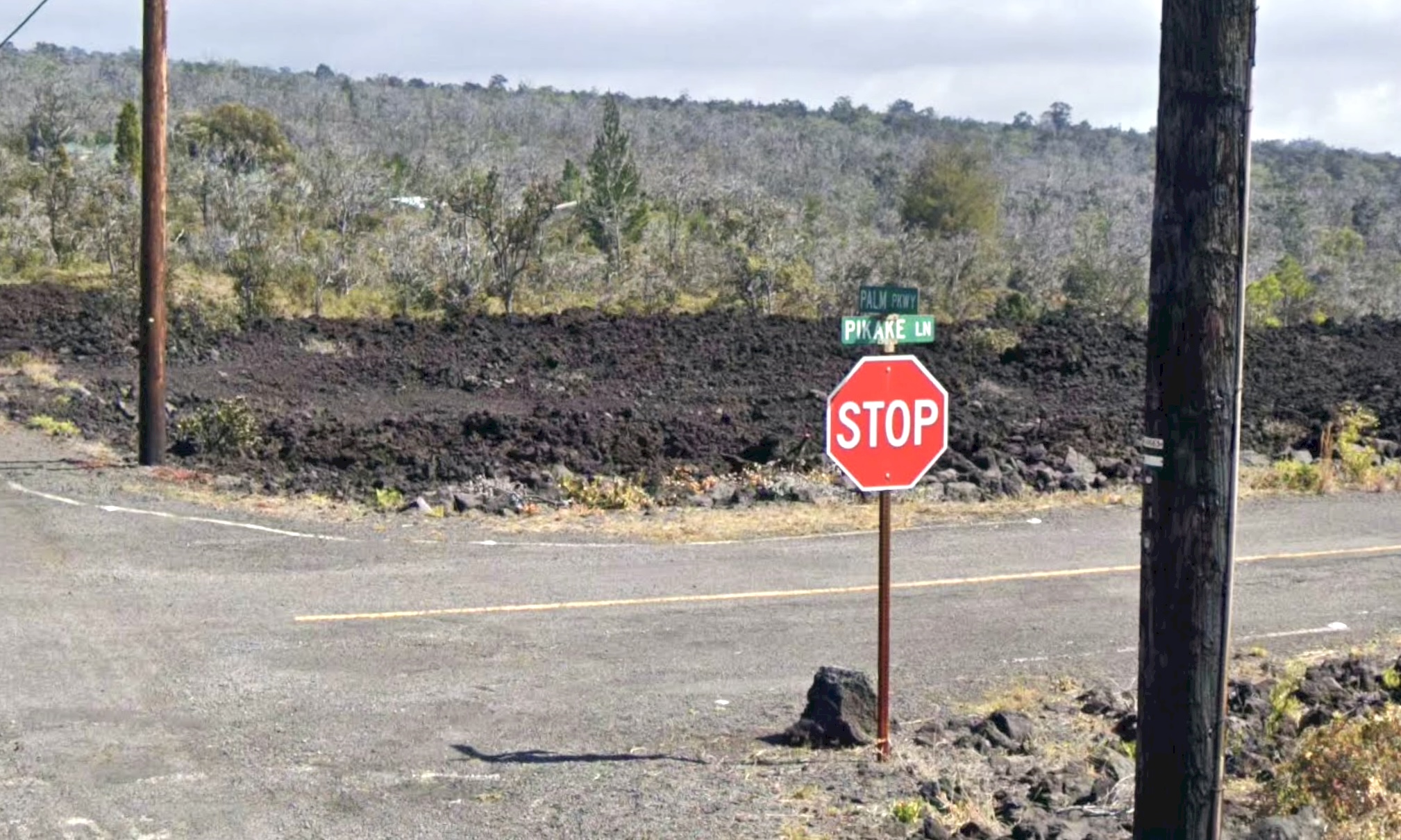 92-8262 Lot 25 Pikake Lane Ocean View, HI 96704 - Photo 4 of 6 a front view of a house with a yard and mountain view in the background