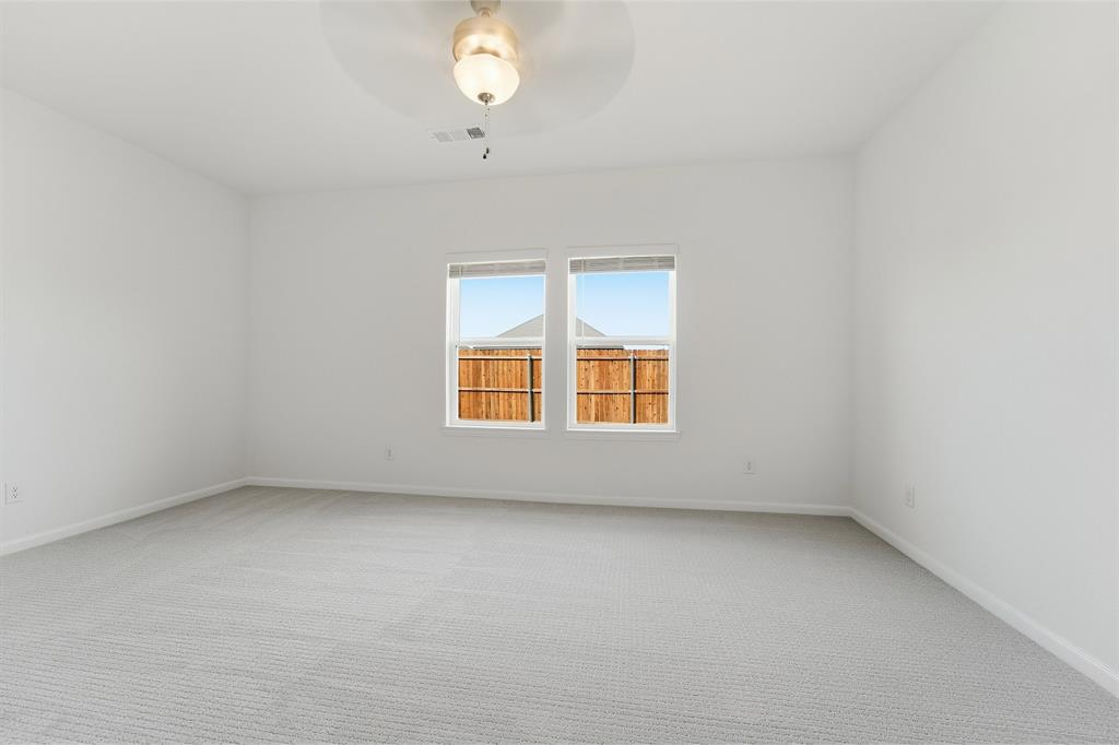 213 Charismatic Road Waxahachie, TX 75165 - Photo 15 of 21 an empty room with windows