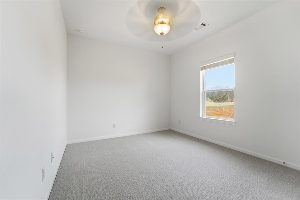 213 Charismatic Road Waxahachie, TX 75165 - Photo 19 of 21 an empty room with a window