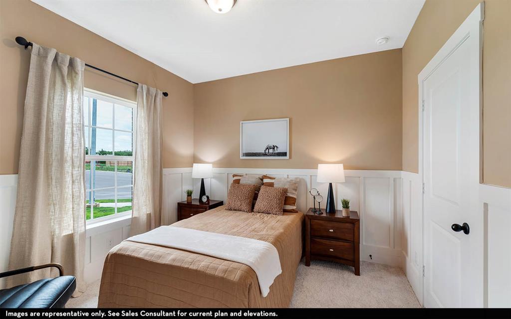 213 Charismatic Road Waxahachie, TX 75165 - Photo 3 of 25 a bedroom with a bed and a window