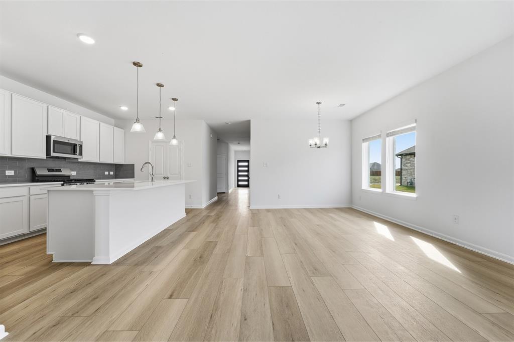 213 Charismatic Road Waxahachie, TX 75165 - Photo 5 of 21 a view of kitchen with sink and wooden floor