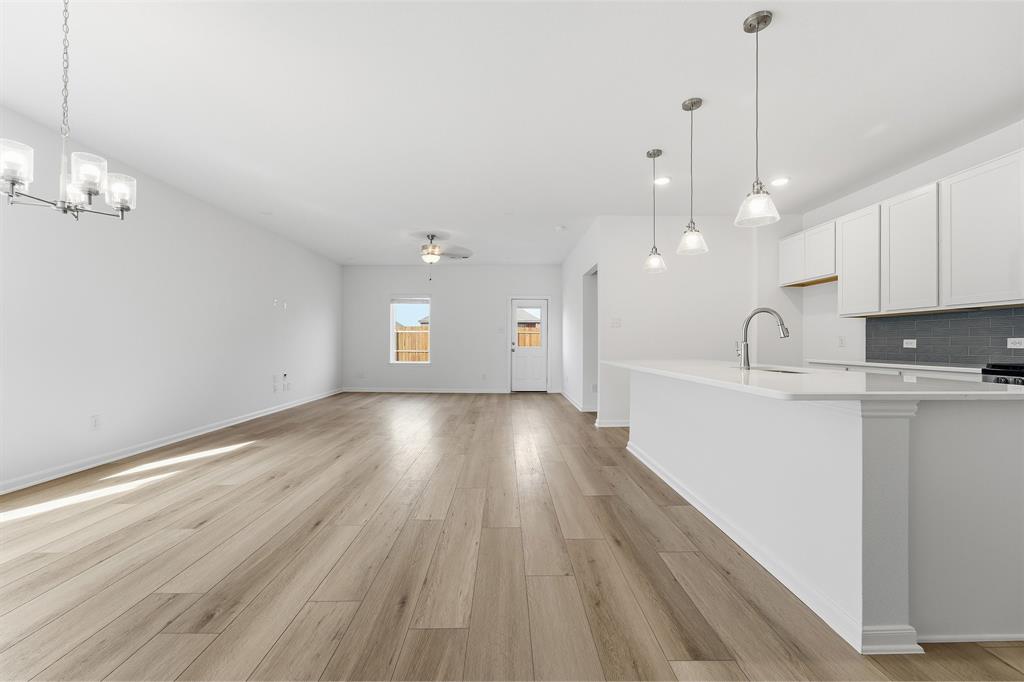 213 Charismatic Road Waxahachie, TX 75165 - Photo 7 of 21 a view of an empty room and kitchen view