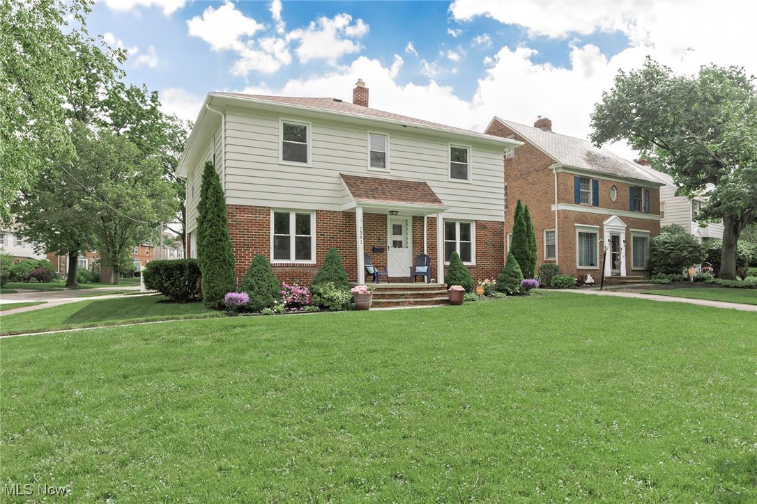 2381 Charney Road Cleveland, OH 44118 - Photo 44 of 47 View of front of property with brick, siding, and a large, beautiful front yard