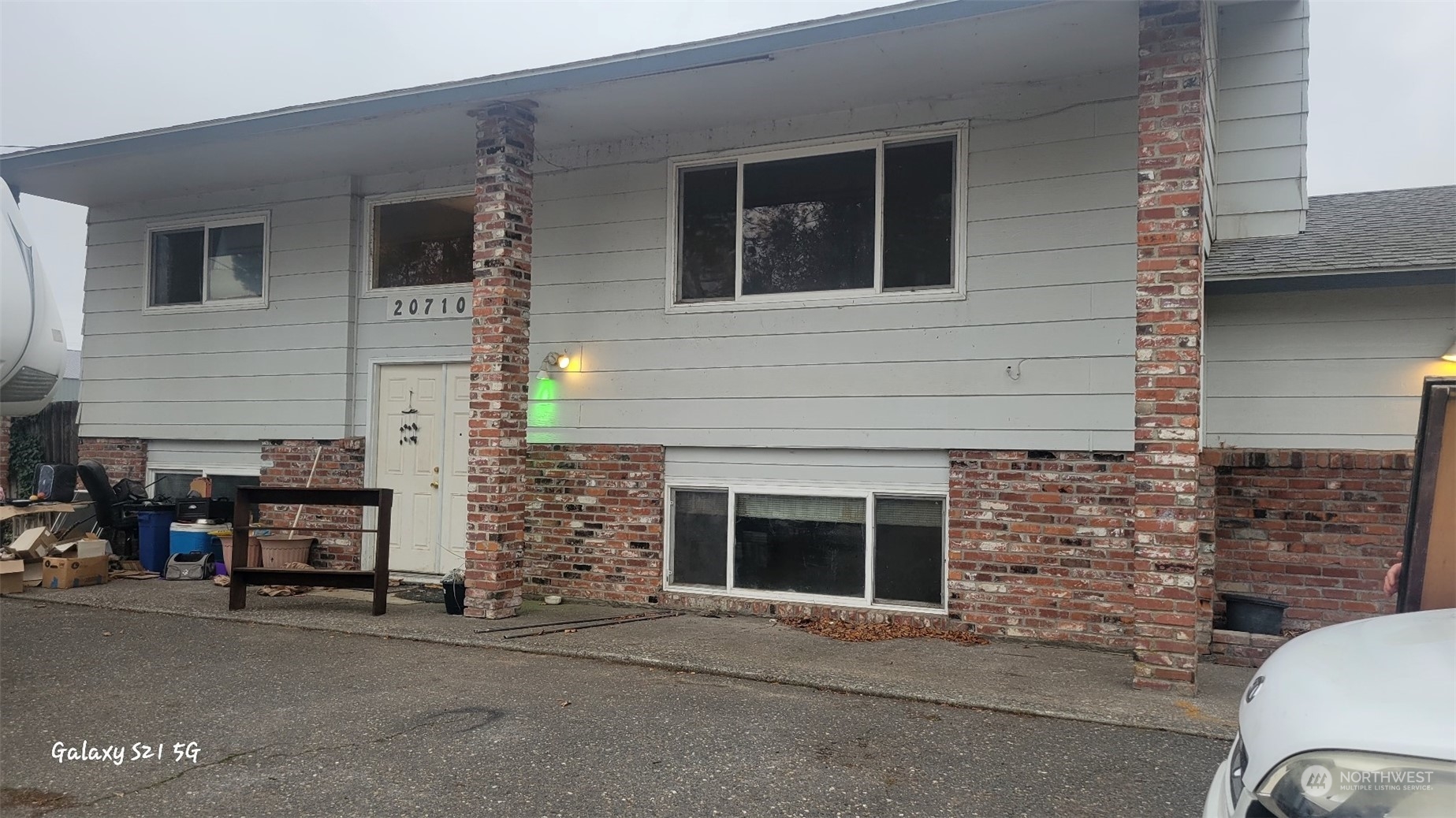 207105 East Finley Road Kennewick, WA 99337 - Photo 1 of 15 a couple of cars parked in front of house