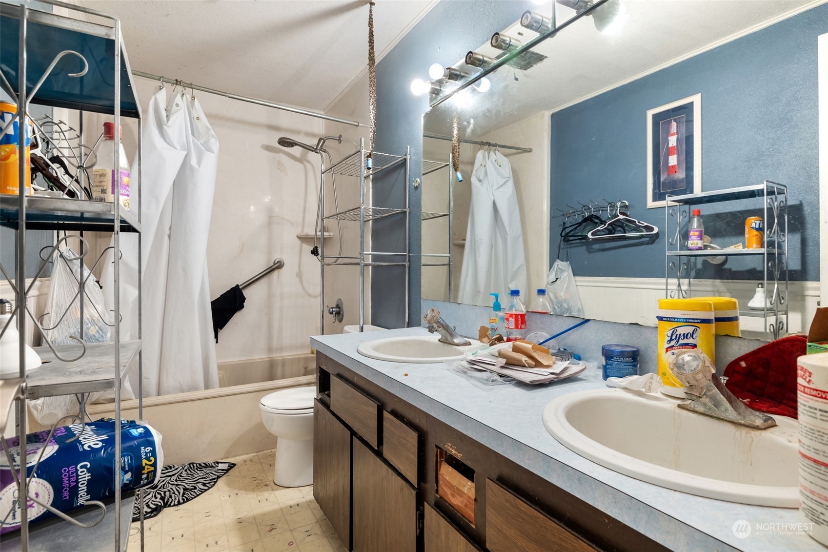 207105 East Finley Road Kennewick, WA 99337 - Photo 15 of 15 a bathroom with sink a mirror a bathtub and shower
