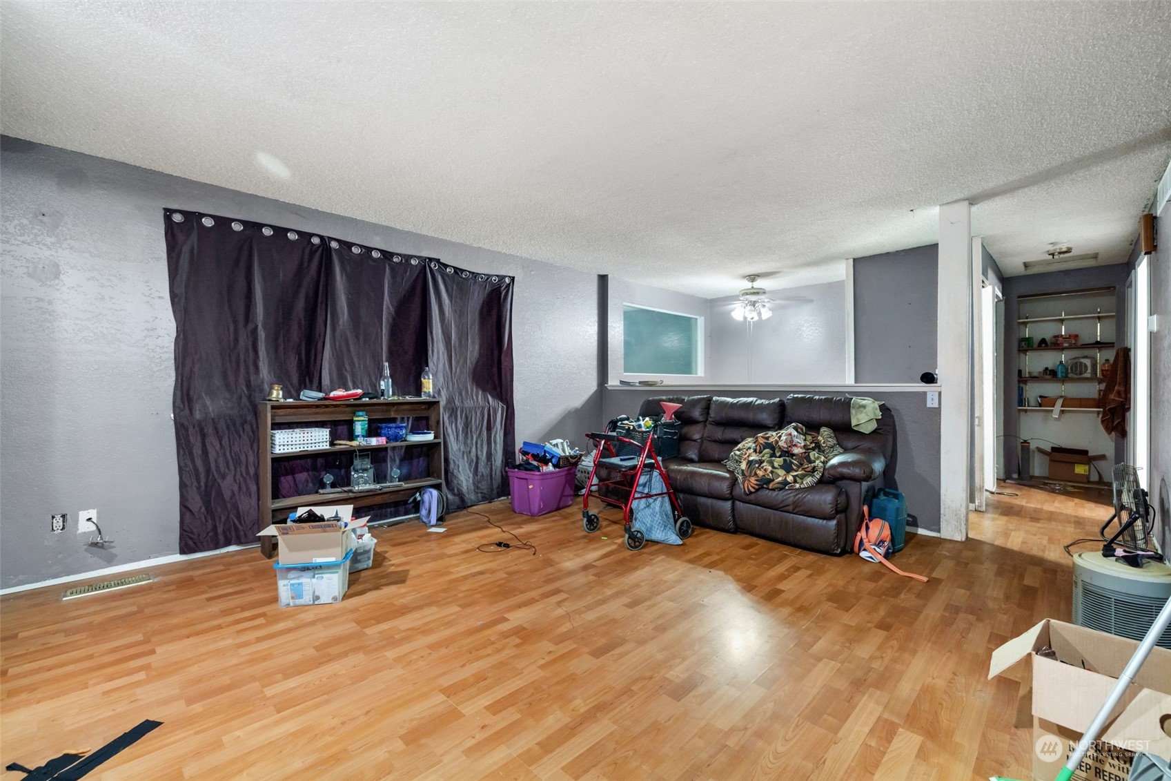 207105 East Finley Road Kennewick, WA 99337 - Photo 3 of 15 a living room with lots of furniture and gym equipment