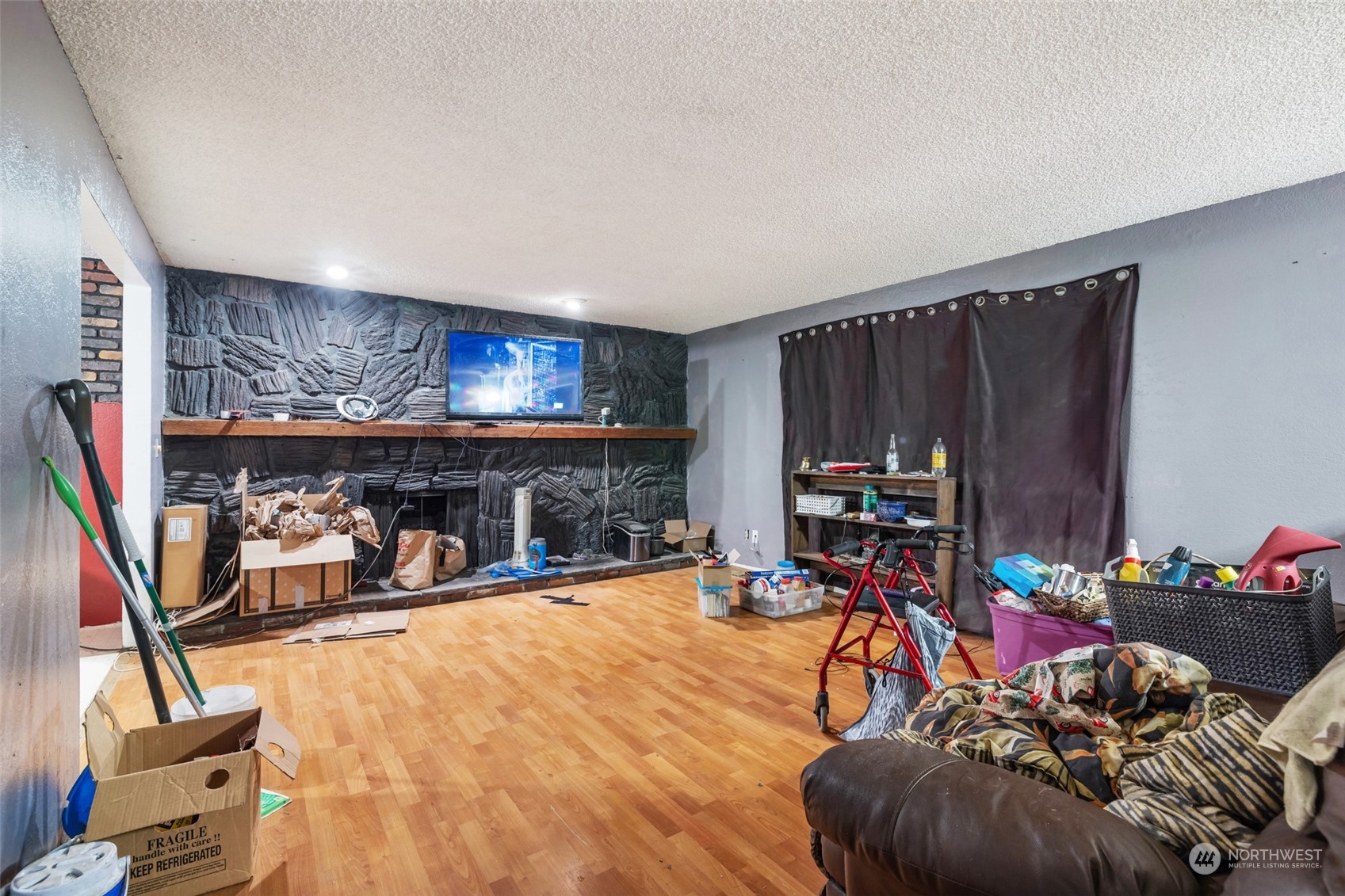 207105 East Finley Road Kennewick, WA 99337 - Photo 5 of 15 a view of a livingroom with furniture and a fireplace