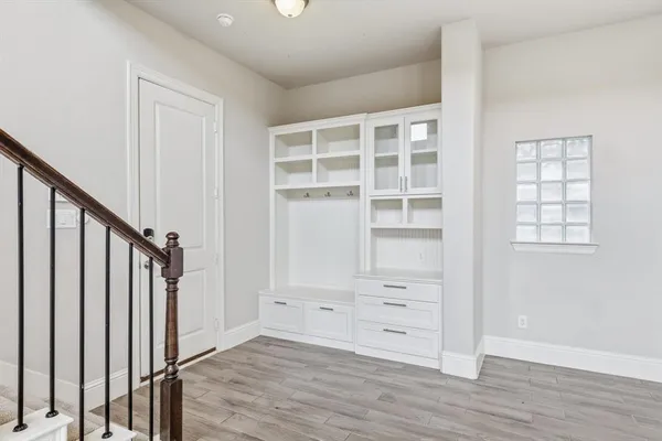 a bathroom with double sink and a mirror