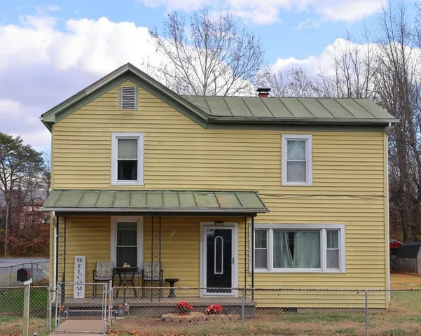 a front view of a house with garage