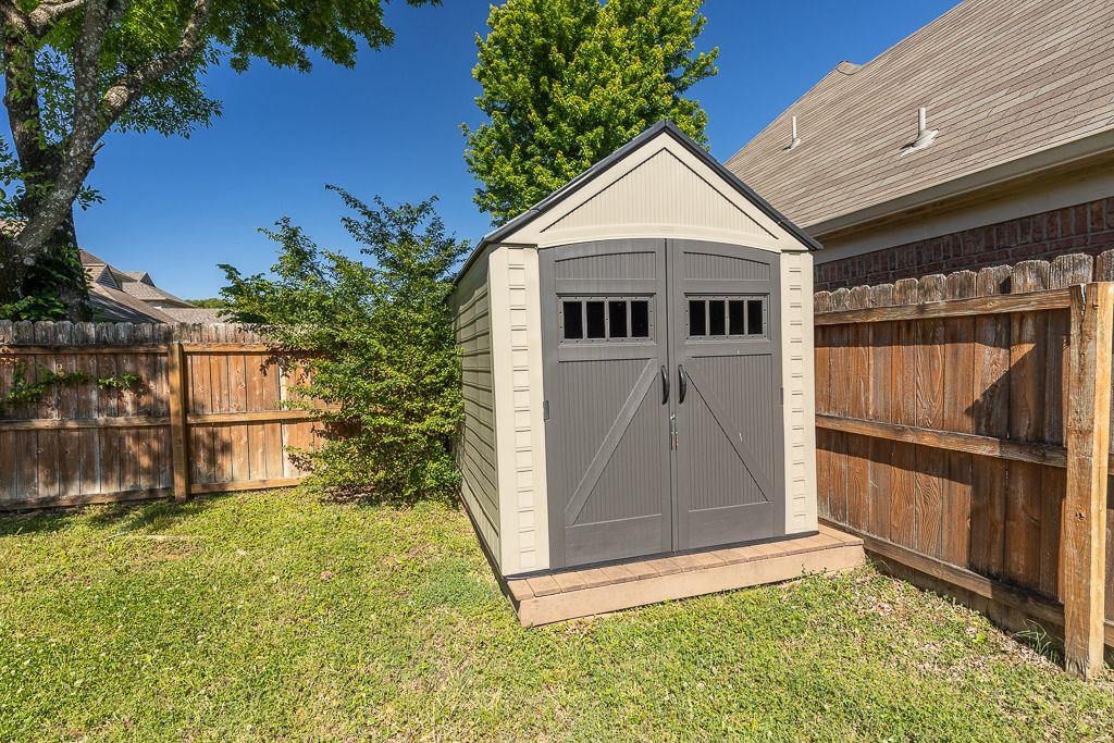9768 Riggin Drive Memphis, TN 38002 - Photo 5 of 32 Outdoor storage shed featuring double doors with window details