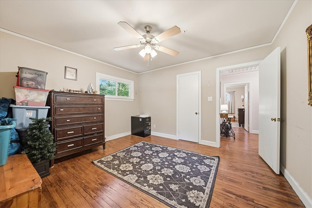 504 Jeb Stuart Avenue Anderson, SC 29621 - Photo 33 of 47 This spacious bedroom features lustrous hardwood flooring and an inviting ambiance, perfect for relaxation.