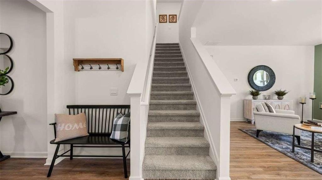 96 White Spruce Way Newnan, GA 30265 - Photo 15 of 43 a view of entryway and hall with wooden floor