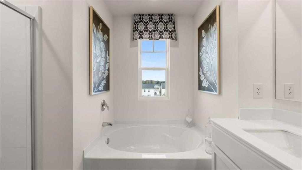 96 White Spruce Way Newnan, GA 30265 - Photo 20 of 43 a white bath tub sitting next to a white sink