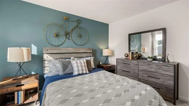 a bed room with a bed and a lamp