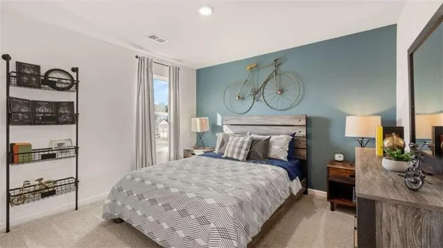 a bedroom with a bed and a table in it