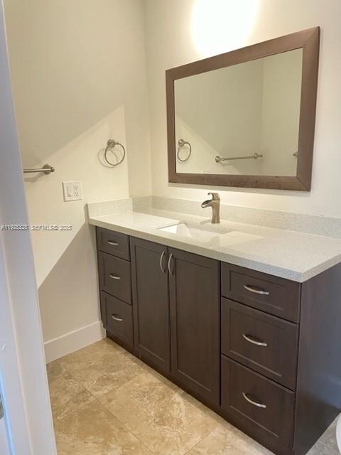 5631 West 28th Avenue, Unit 1 Hialeah, FL 33016 - Photo 13 of 18 a bathroom with a sink vanity and mirror