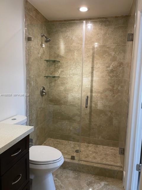 5631 West 28th Avenue, Unit 1 Hialeah, FL 33016 - Photo 14 of 18 a bathroom with a shower and a toilet