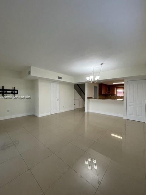 5631 West 28th Avenue, Unit 1 Hialeah, FL 33016 - Photo 2 of 18 a view of a livingroom with furniture and a ceiling fan