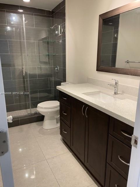 5631 West 28th Avenue, Unit 1 Hialeah, FL 33016 - Photo 8 of 18 a bathroom with a sink a toilet and shower