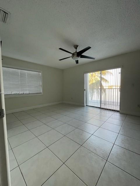 5631 West 28th Avenue, Unit 1 Hialeah, FL 33016 - Photo 9 of 18 a view of an empty room with a window