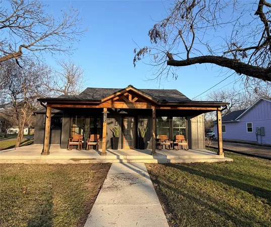 a view of a chairs and table in the patio