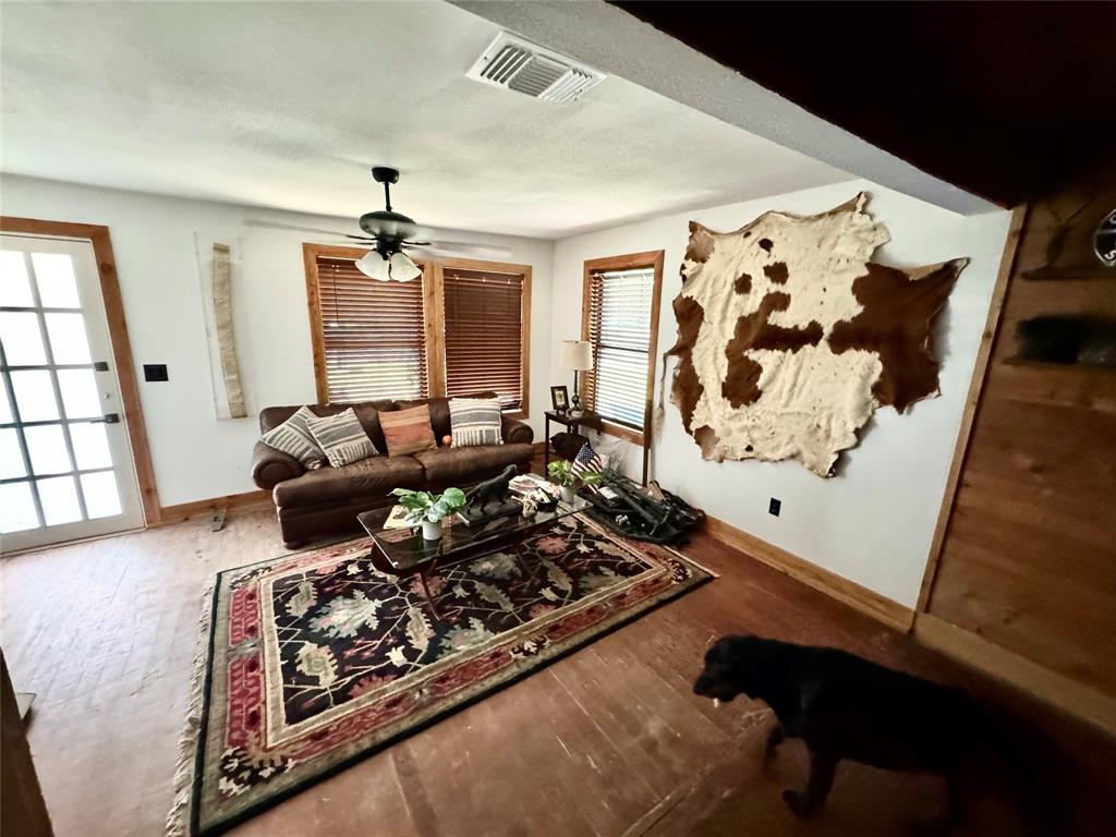 1605 South Houston Street Kaufman, TX 75142 - Photo 11 of 27 a living room with furniture and a window
