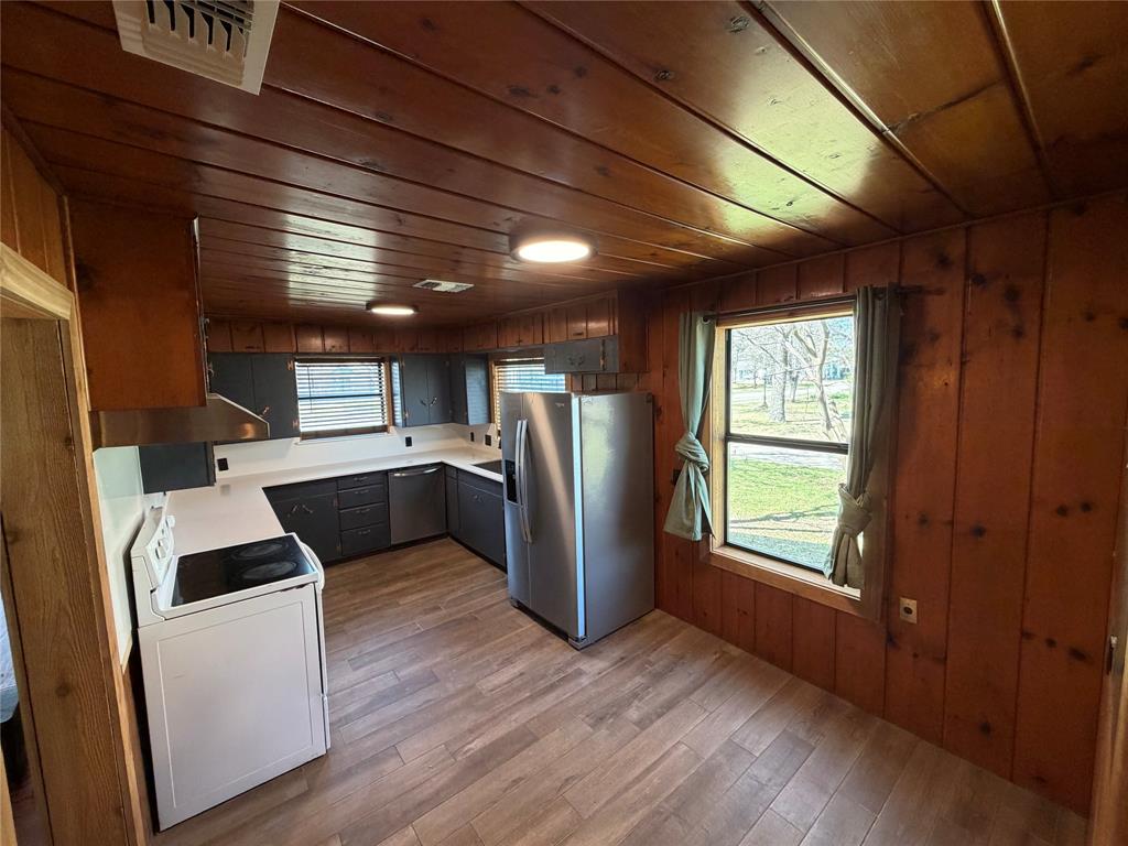 1605 South Houston Street Kaufman, TX 75142 - Photo 15 of 27 a view of kitchen with furniture wooden floor and window