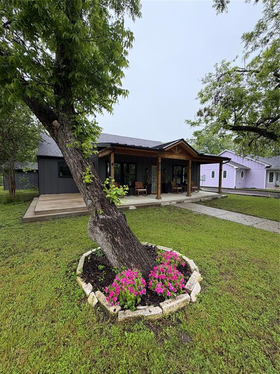 1605 South Houston Street Kaufman, TX 75142 - Photo 5 of 27 a view of a house with a yard patio and swimming pool