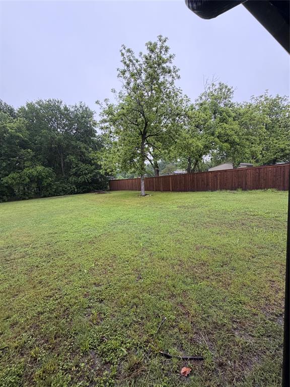 1605 South Houston Street Kaufman, TX 75142 - Photo 7 of 27 a view of a field with an trees in the background