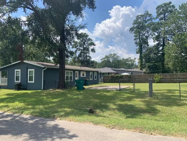 a house view with swimming pool in front of it
