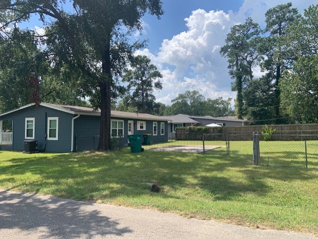 1000 Thomas Avenue Conroe, TX 77301 - Photo 20 of 20 a house view with swimming pool in front of it